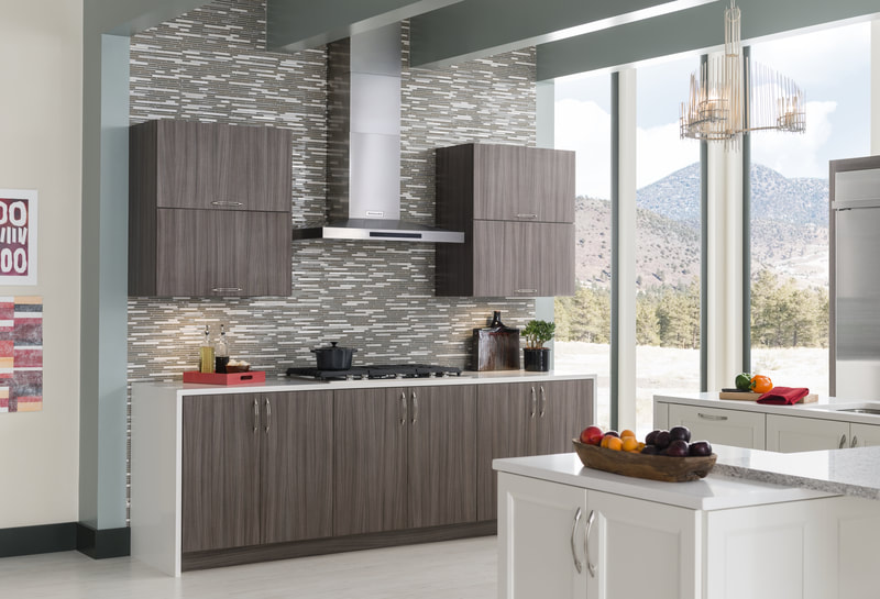 White and brown kitchen with work island and tiled backsplash