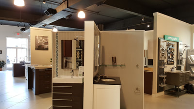 Bathroom fixtures, towel racks, and storage ideas at Broadway Kitchens & Baths showroom