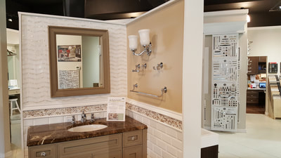 Bathroom vanity, lighting, and mirror display at Broadway Kitchens & Baths showroom