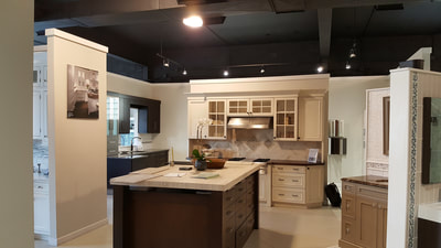 Kitchen display with cabinets and work island, Broadway Kitchens & Baths showroom