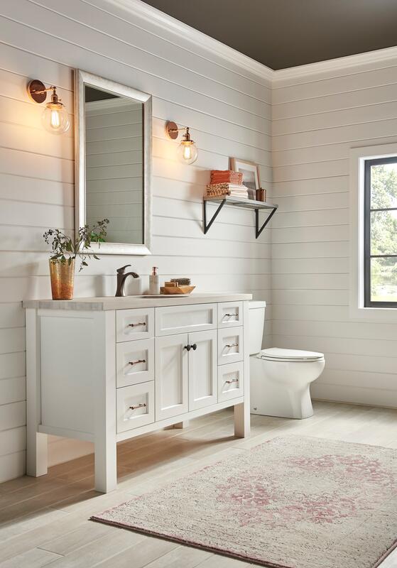 White bathroom with custom cabinetry and shelving