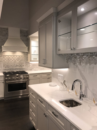 White kitchen, closeup of range and sink