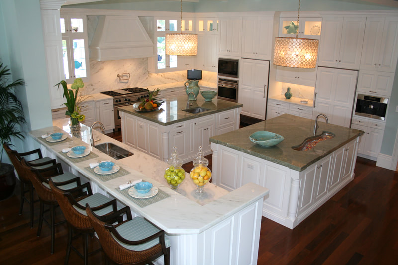 White kitchen with two work islands
