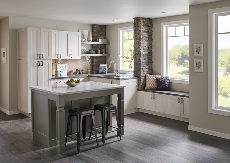 White, beige, and gray kitchen with work island and window seat