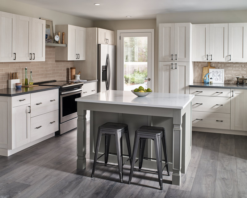 White, beige, and gray kitchen with work island