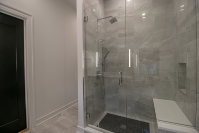 Bathroom remodeling project, tiled shower with glass doors 