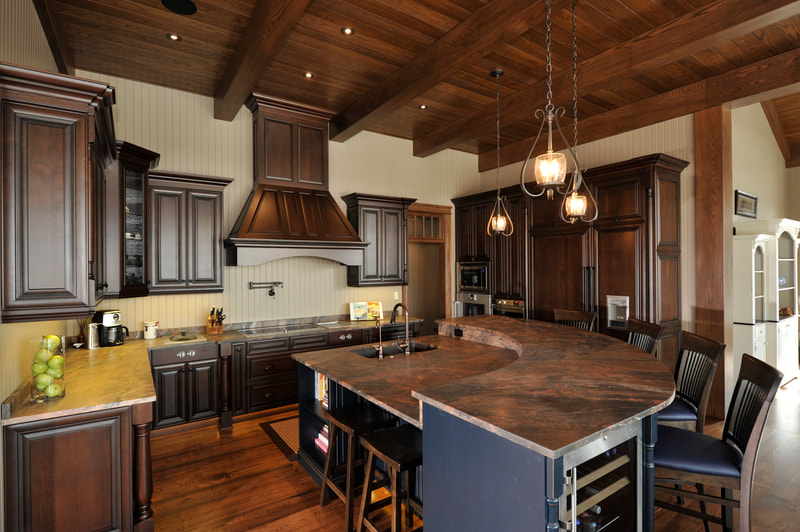 Dark wood color kitchen with black accents in island