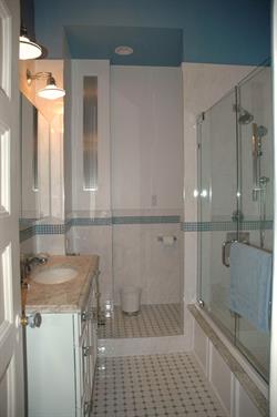 Tiled bathroom with glass-door shower