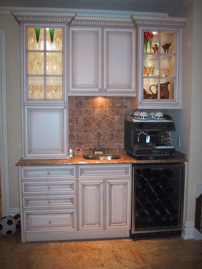 Wet bar and coffee station with sink and tiled backsplash
