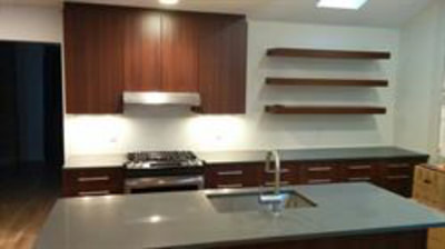 Kitchen with natural wood color cabinetry and open shelving
