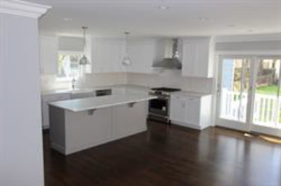 White kitchen with dining island