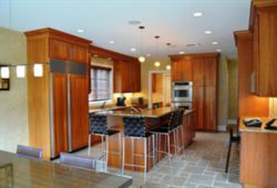 Natural wood color kitchen with dining island