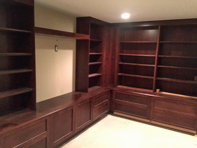 Home theater with built-in shelving and storage