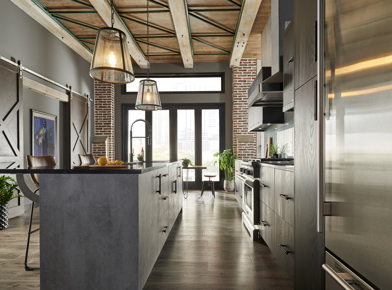 Black and gray kitchen with work island