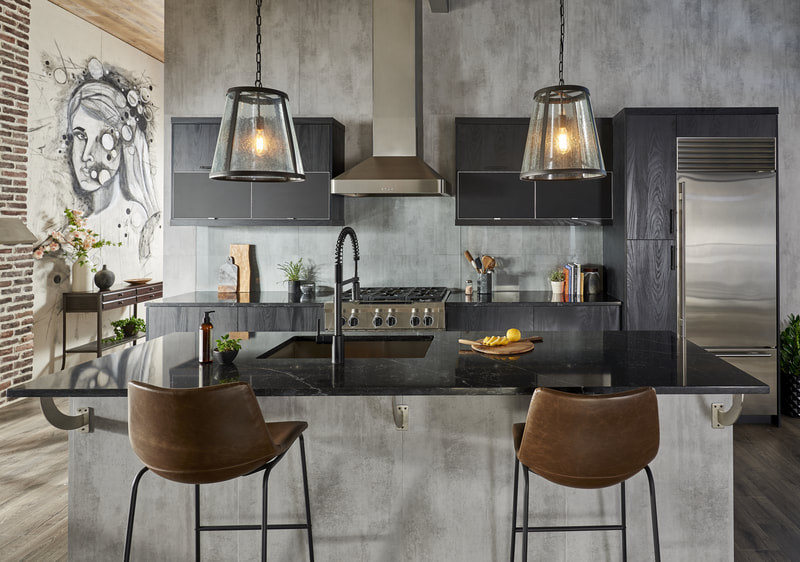 Black and gray kitchen with work island