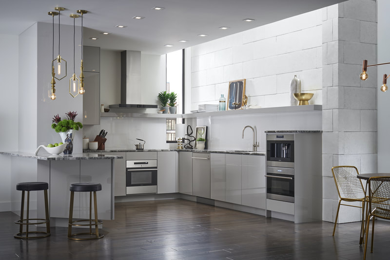 White kitchen with black and stainless steel accents